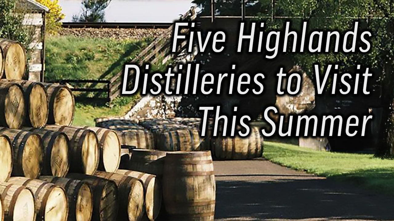 A photograph of the exterior of a scottish distillery with dozens of barrels stacked on the left and a few barrels laid on a path in the middle. There's superimposed text reading: Fixe Highlands Distilleries to Visit This Summer.