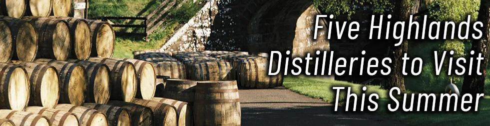A photograph of the exterior of a scottish distillery with dozens of barrels stacked on the left and a few barrels laid on a path in the middle. There's superimposed text reading: Fixe Highlands Distilleries to Visit This Summer.