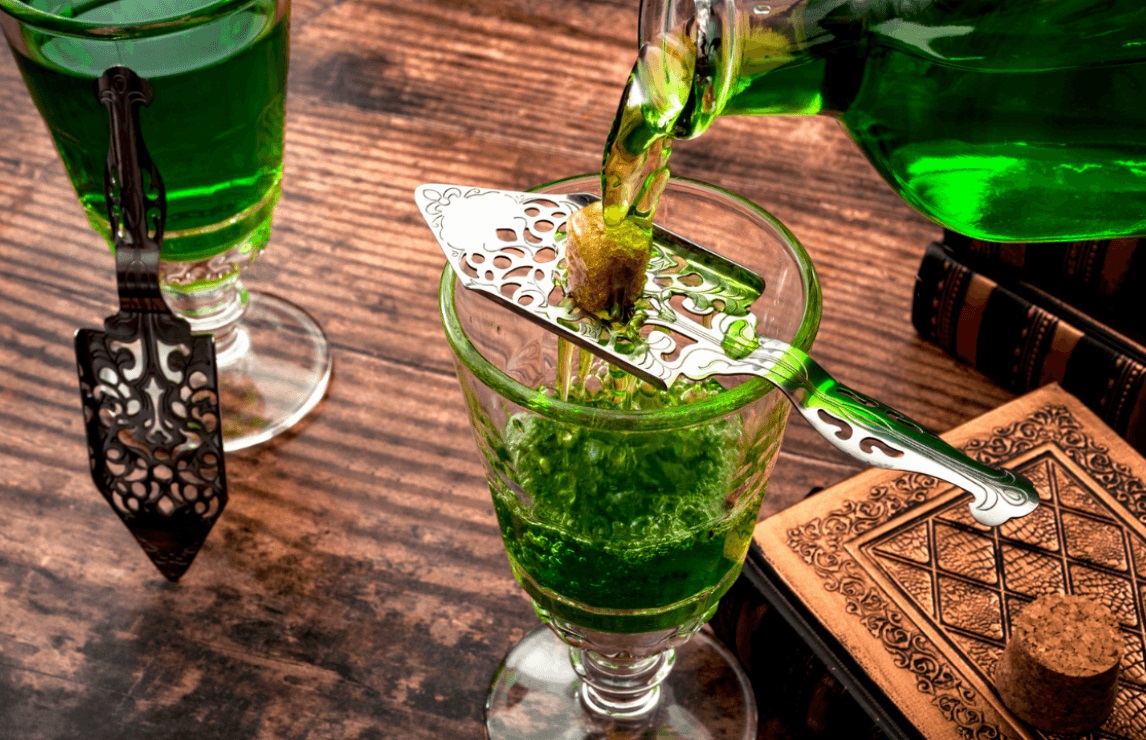 Absinthe is a highly alcoholic spirit traditionally made from wormwood, anise, and fennel, often distilled with various herbs and botanicals.